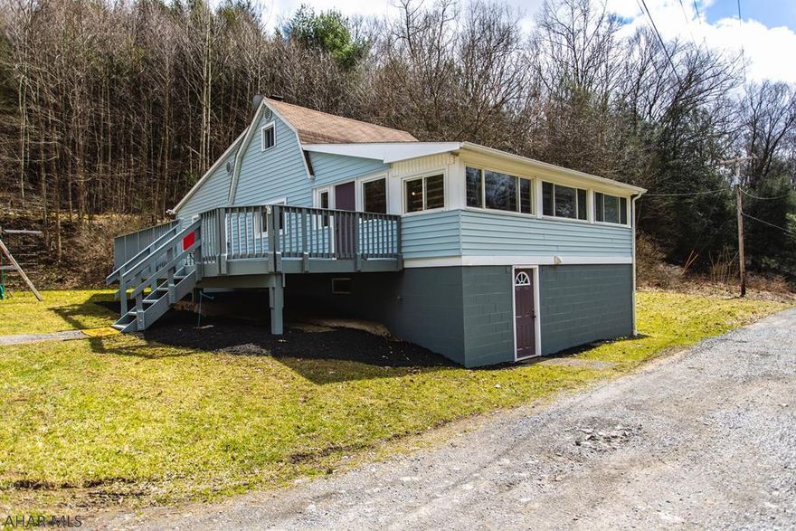 Fantastic, cozy 2 bedroom, 2 bath house on 5 acres. Country living at it's best. Enjoy the wildlife that roam the 5 acres. The large deck is perfect for summer evenings with family and friends. Large 2 car garage. Beautiful stone fireplace is the focal point of the cozy living room.