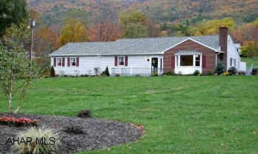 Lovely Ranch Home on 1.13 acres, professionally landscaped, El Dorado stone accents, wood fireplace in living room, front and rear deck, carport, oversized two car garage. All freshly painted thru-out, raised perennial flower bed.