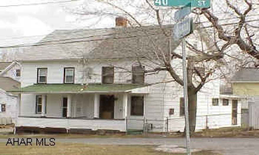 Great Fixer Upper - Fenced yard & tons of potential.  1/2 double - 1st floor laundry.