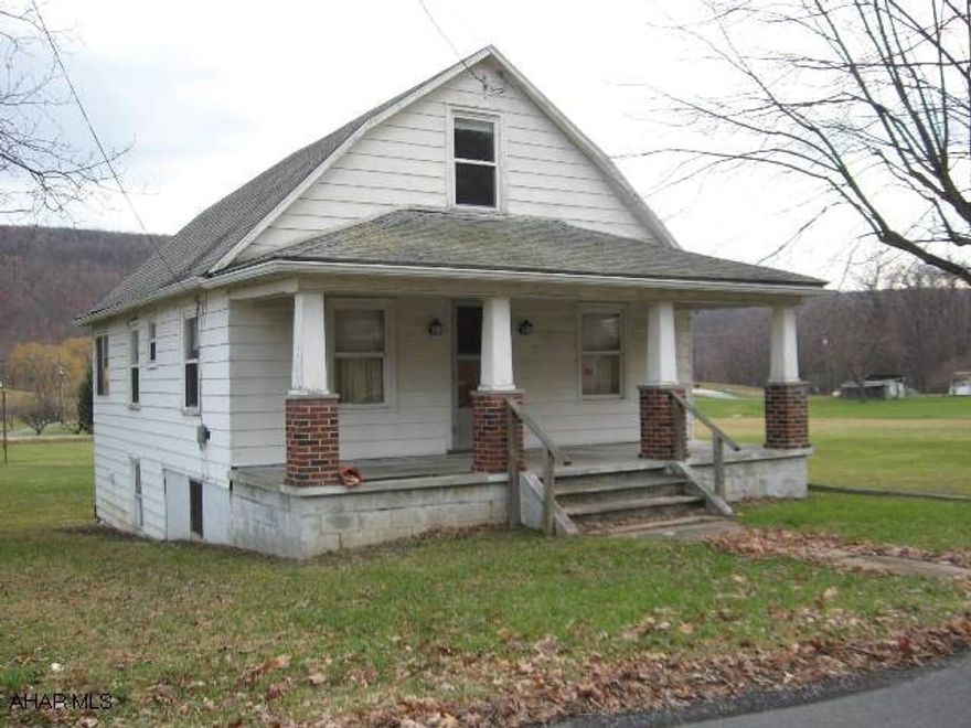 Don't pass this up!  This 1 1/2 story home is situated on an exceptional level 3 acres only minutes from downtown Bedford.  It features: an oversized 2 story garage, two heat sources (oil or coal), some upgraded windows, apple trees, views and lots of room to expand.  It needs TLC and is offered As Is in its present condition.