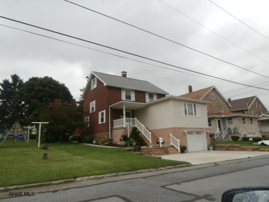 Beautiful brick 2.5 story home that has been carefully maintained and is in great condition. Front addition in 2008 includes large living room and garage. Hardwood floors and hickory kitchen. Nicely finished third floor. Bath has been updated and included a heated ceramic floor. Large rear deck and front porch - concrete drive - this home has it all!!