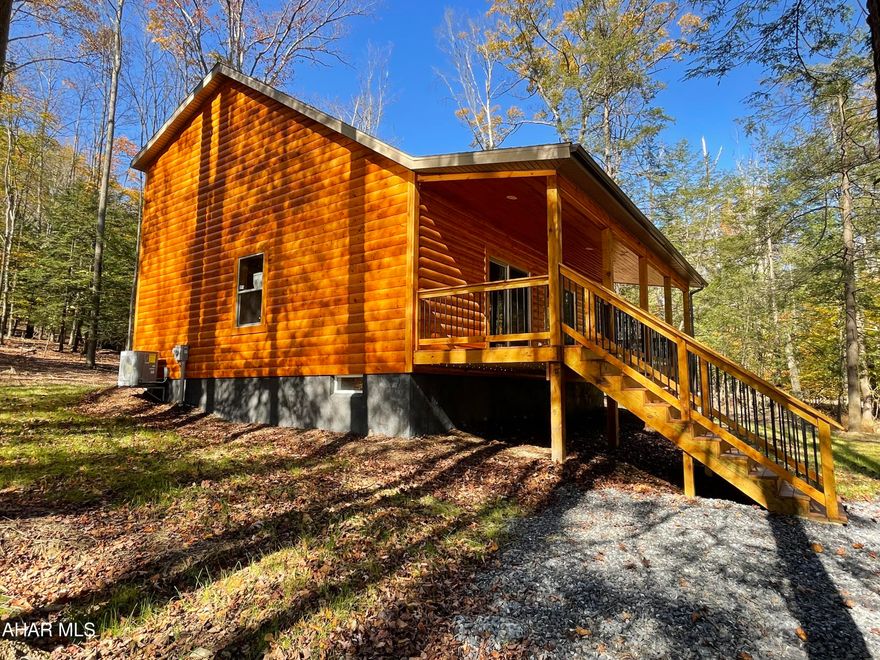 Located minutes from Glendale lake is this unique gated community that offers many amenities such as swimming pool, tennis/basketball/volleyball courts, hiking trails and park. This amazing place started out  as a mountain get away, an escape from the hustle and bustle of city life, and the people fell in love with the area and now many of the residents reside here all year long.  This property will allow you to connect with nature as deer will relax outside your front door. Brand new construction built by a local respected custom home builder using the finest materials such as pine pond log interior that was shipped from New York, luxury vinyl flooring throughout for easy maintenance and two sources of heat, heat pump and a propane furnace. On the first floor you have kitchen with butcher block countertops brand new appliances, including a microwave built into the pantry, and around the corner a stackable washer/dryer built into a closet. There is a first floor bedroom with bath connected to the great room with a vaulted ceiling that is open to the balcony upstairs on the second floor. Upstairs you have two spacious bedrooms connected by a full Jack and Jill bath. All of this is sitting on a full unfinished basement.  Plenty of room to expand indoors and outdoors with slightly over an acre parcel.  If you are looking for a permanent residence or just a place to get away give me a call.