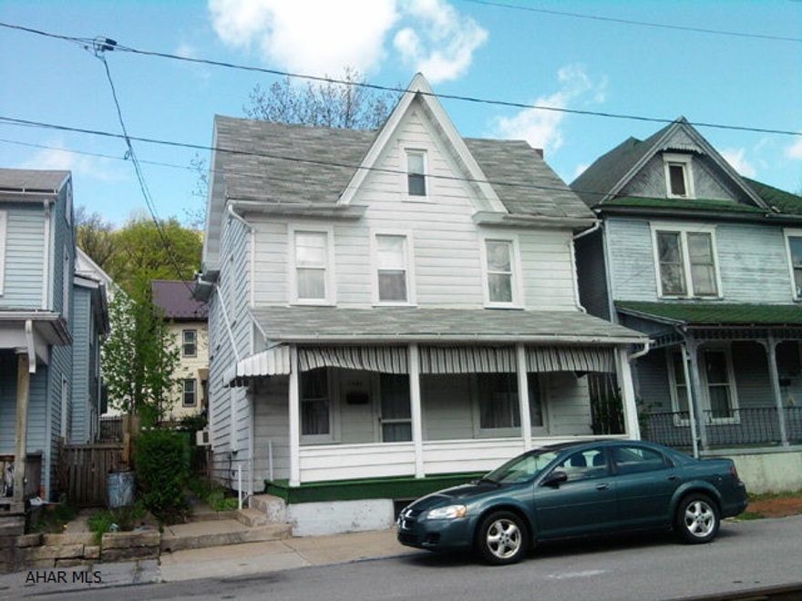 2 1/2 story, 3 bedroom home with hardwood floors, new carpeting and updated wiring.