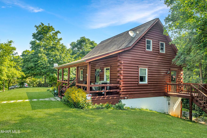 Here is your opportunity to own a log home with extraordinary views of the surrounding mountains. The home and large, three car detached garage is situated on a 1.67 acre lot. The kitchen features white cabinets. an island and stainless appliances and is open to the living room and exposed beams. Main level bedroom with additional loft bedroom. and partially finished basement. Hollidaysburg Area School District. High speed internet available. Check out our 3D virtual tour and schedule a showing today.