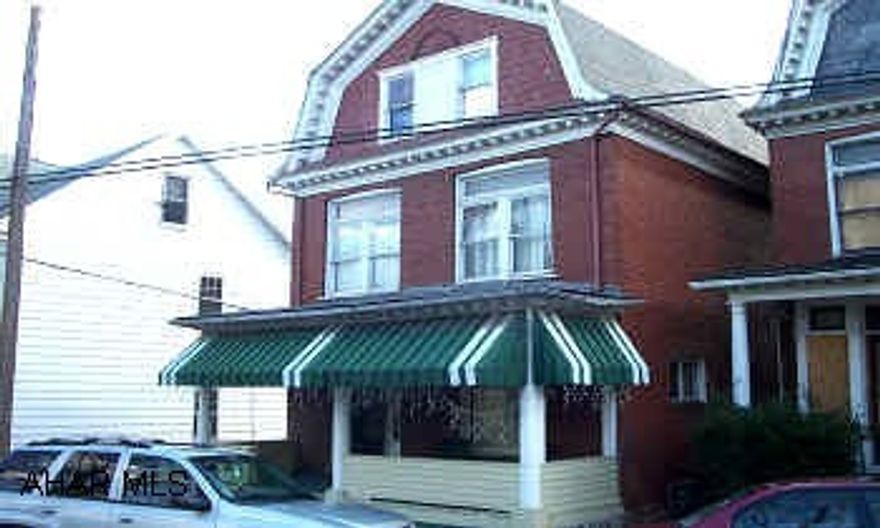 Solid 3 story brick near Altoona Hospital. Wood fireplace, newer furnace, 3rd floor has four 8x11 bedrooms. Roof in good shape.