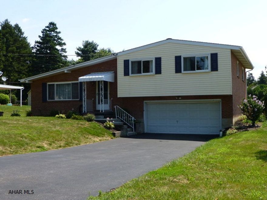 BEST VALUE IN BLAIR COUNTY. This home is now priced below market value.Immaculate 3Br home located in desirable Sylvan Heights area!This home offers hardwood and tile flooring. The large living room features vaulted ceilings. All appliances stay in the large, tiled kitchen. A huge 20x26 area in the lower level can easily be another family room. The large private yard includes the playset & offers great views including Chimney Rocks.Don't miss this rare opportunity...