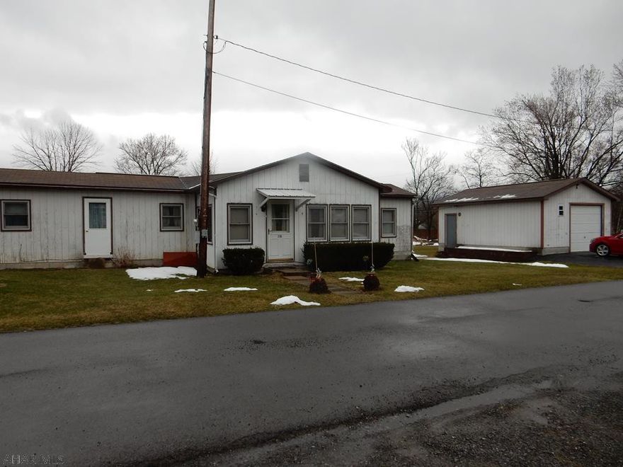 Hollidaysburg Schools with low taxes and a on permanent foundation.  Sits on a 50 x 200 nice, level lot with shed and detached two car garage.  Bonus room add on, could serve as an additional bedroom if desired.  Just bring your TLC to this motivated owner !!!