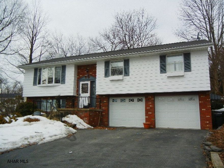 NEW PRICE!!  This home is in move in condition- offers a wonderfully functional kitchen that was recently updated including honey oak cabinetry, granite countertops and breakfast bar with granite counter, recessed lighting and ceramic flooring.  The dining room also has ceramic flooring, textured ceiling and walks out onto the private screened in porch with natural gas grill!!  The living room offers lots of natural light.  Master bedroom is large and also has updated Master bath with ceramic flooring and large shower w/custom ceramic walls.   Family room is spacious enough to entertain family and friends.  Some updates include: new driveway (2009), new energy efficient garage doors (2010), Central air (2011), basement carpet (2013), new Fridge and stove (2014)  Call agent for showing