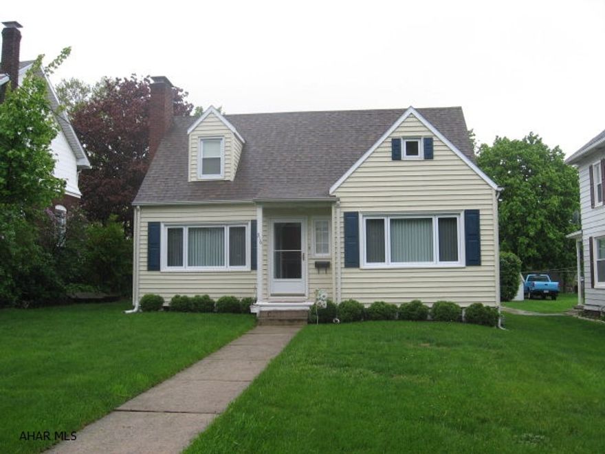 Move in ready 3-4 bedroom home features hardwood floors, a newly remodeled kitchen, a large sunroom, new windows, and off street parking.