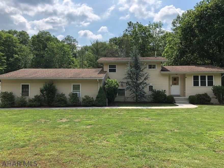Excellent condition is this 2Bed 2 1/2 Bath Split level on a 1.25 acre lot on a dead end street.  Semi private setting, flat lot with 2 sheds, 12x28 and 14x28, also parking for 10 cars with a carport also.  2 car attached garage is 32x32x10 foot ceilings.  Also has a 1/2 Bath, propane heat, built in cabinets and room to just hang out!!  Too many amenities to list!  Location, location with awesome setting - won't last!