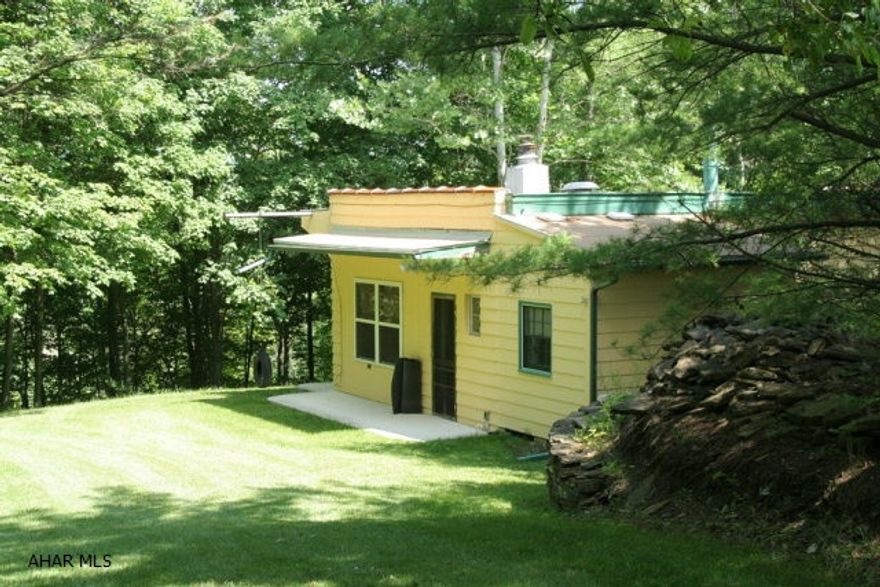 Sturdy built retreat off of Dunnings Creek. Featuring 10ft ceilings, stunning stone fireplace, unique barn board wainscoting and window trim. Two separate bedrooms and full sized bathroom with tub and shower. Large open kitchen, dining and living space. Loft area above bedrooms for extra sleeping or storage. Storage shed/garage with work bench in back. 30ft right of way to Dunning Creek. A great get-a-way with lots of privacy.