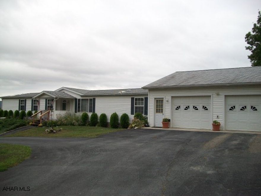 This is a beautiful, spacious home in great condition.  Large, rear covered deck has amazing view.  Central air.  Very quiet and private location.  Paved driveway.  Oversized garage offers plenty of work space.  Two very large storage sheds in great condition included.  Cement piers with tie-downs. Property offered at appraised value - appraisal available upon request.