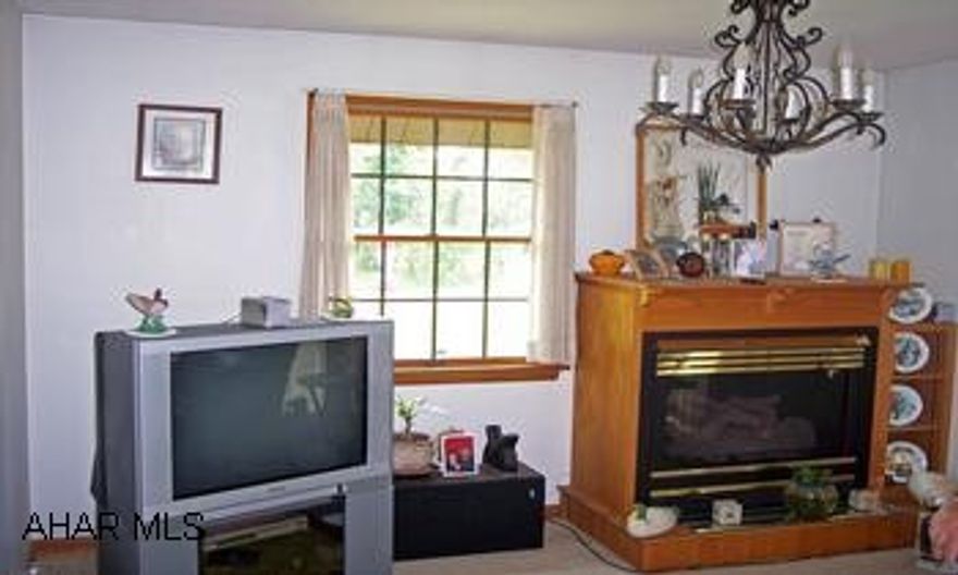 Beautifully kept 3 Bedroom 2 Bath, stick built 1991 home is located on 3 acres.1979 Skyline home is included, renting at $450 per month. This one pays for itself. Like new carpeting, oak staircase, each bedroom has large closets. Two for one! A beautiful kept home and a mobile home. Mobile home is a 1979 Skyline 3 bedroom, 2 bath. New roof, new window all with a private drive. A great "Mother in law" home, or keep as an income producer. Current tenant pays $450 rent, electric on seperate box and heat. .