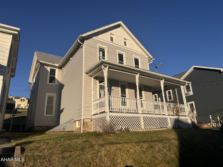 A lot of potential for this spacious two story vinyl sided home featuring 4 bedrooms, 2 1/2 baths  with wraparound deck.  Original woodwork & trim throughout.  Heating system does have some freeze damage & the electric meter has been removed.  200 amp electric service.  Add your own finishing touches. This property may also be marketed via an auction event at https://www.hubzu.com (void where prohibited) The seller will review offers submitted through the auction site as well as through the listing agent.