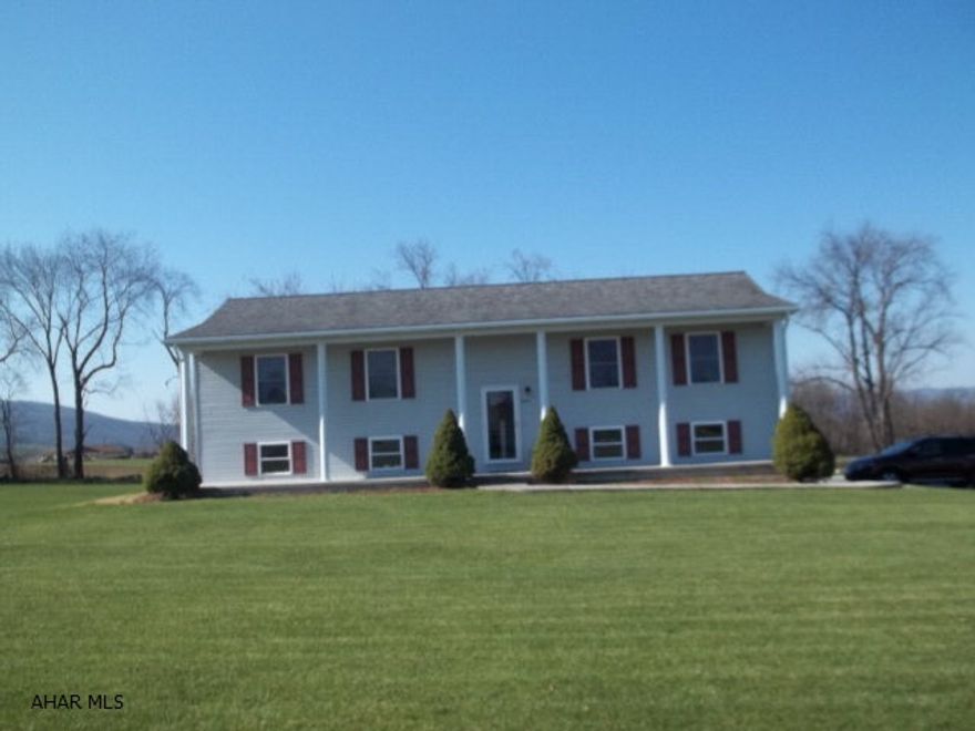 Life at its best in the country.  Check out this super clean, (totally move-in ready)  home with large living area, 3 BR's, 2.5 Baths, finished basement and amazing views of the Cove.  Sitting on an acre and just waiting for a new owner. Call the listing agent to schedule a showing.  Did I mention that this home qualifies for a USDA (no down payment) loan, and has public water and sewer?