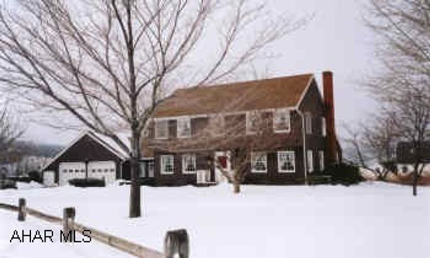 THIS HOME HAS LOTS OF CHARM. CEDAR ENCLOSED PORCH OFF MASTER WITH WONDERFUL VIEW. ENCLOSED BREEZEWAY FOR A DEN. COZY FAMILYROOM WITH BRICK FIREPLACE. LARGE COVERED DECK.