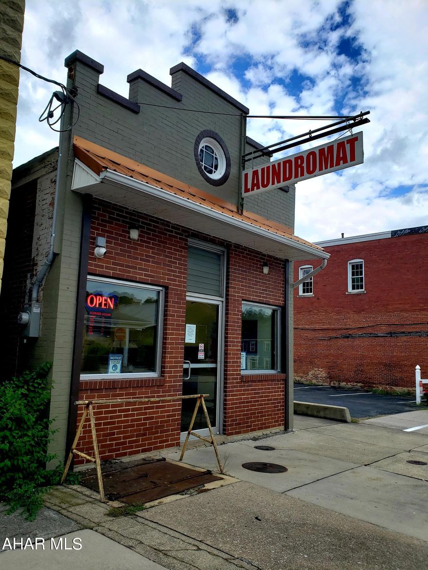 Amazing commercial opportunity in Williamsburg! Investors, check out the possibilities - a chance to own a fully operational turn key laundromat in the heart of Williamsburg, along with 10 highly coveted off street parking spaces, and additional income opportunities in the commercial/rental spaces behind the laundromat. Laundromat features NEW plumbing, heating and cooling, electrical, drywall, and insulation - completely re done in January of 2021! Doors are on self timers for easy management. Back building features a ground floor space and a second floor rental. The ground floor commercial space has some mechanical and cosmetic work done - just needs finishing touches! One or two bedroom apartment upstairs needs some work done. Do not let this great opportunity pass you by - schedule your showing today!