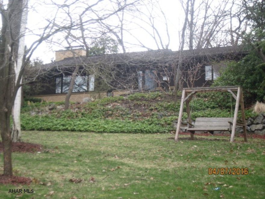 Secluded, Extraordinary, Spacious, Inviting. This home has something on all 4 levels. With a recent facelift it's freshly painted, clean, and ready to move in. Quality built and with all the necessities: Ice maker(s), 2 fireplaces, skylights, cedar closets, wine closet, vaulted ceilings, bright cheery rooms, lots of closets, stone patio, keyless entry, C/A, home office, Gym, and much much more. The large and very private lot is professionally landscaped and has a wrap around drive and a fire pit. You will be impressed. NEW YEARLY TAXES FOR 2017 ARE $4475.00