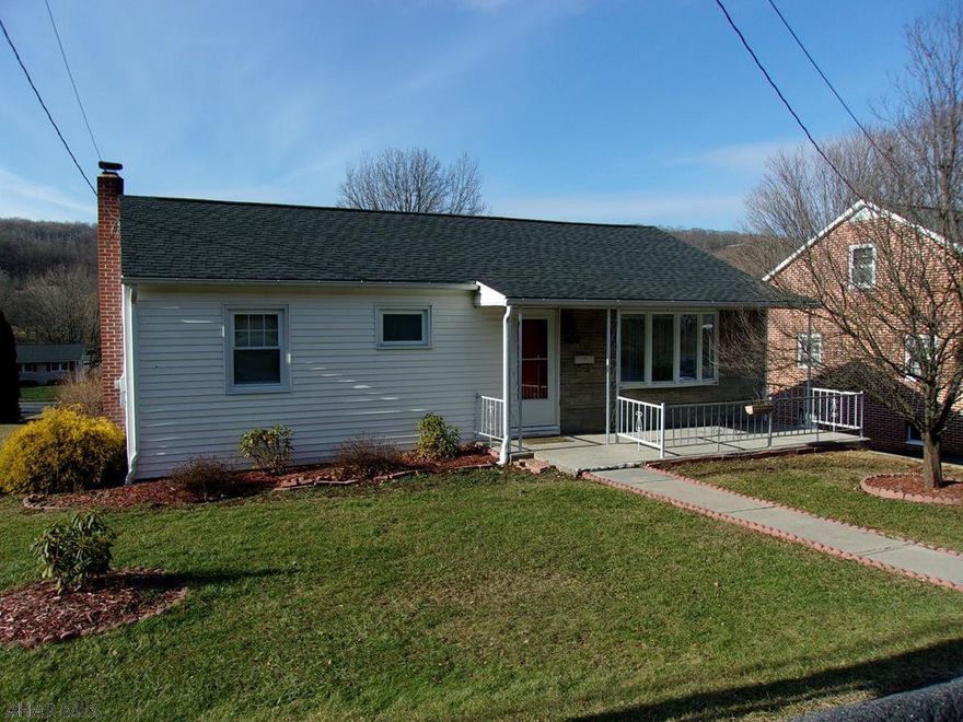 Starting out? Downsizing? This cozy 2 BR ranch is just right. Lots of parking, integral garage and street to street lot. House has been freshly painted inside and new carpeting added (hardwood floors in LR, BRs & hall). 3 season sunroom adds living space w/ lots of windows to enjoy the view. Basement has a separate entrance and a handy catch-all mudroom. The family room has cedar closets and is ready to finish to your liking.