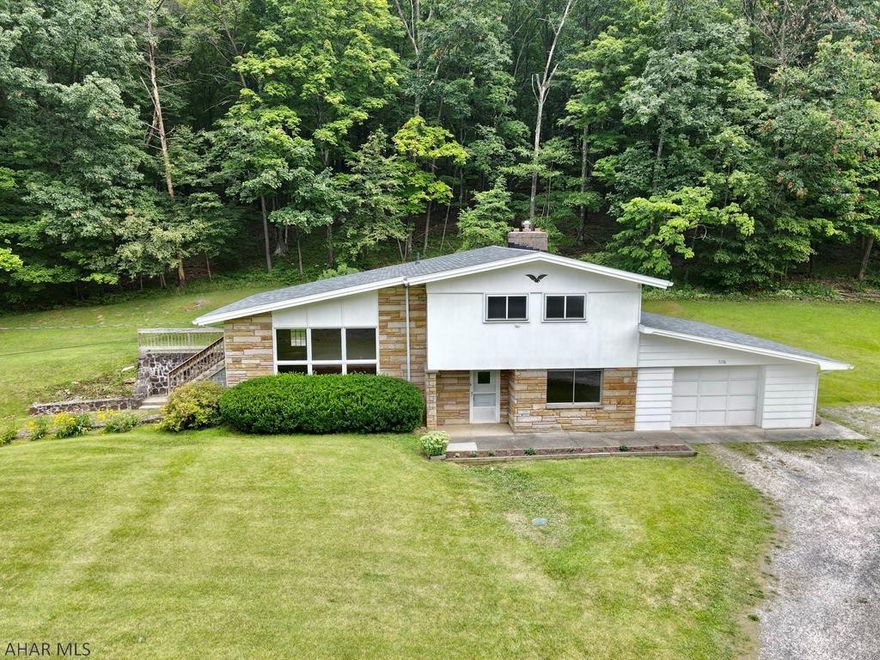 Beautifully updated home on almost 1.5 acres.  Enjoy the large yard, sit on back cement patio, or work in the garage work shop.  Enjoy watching the deer in the yard or grow a garden in the already fenced in area.  This home shines with character with he original hard wood floors, to the large windows in the living room, updated lighting, and open foyer.  Nice size bedrooms with updated full bath.  New updated electric panel, well, septic, roof, hot water tank, and so much more.  Don't miss this gem.