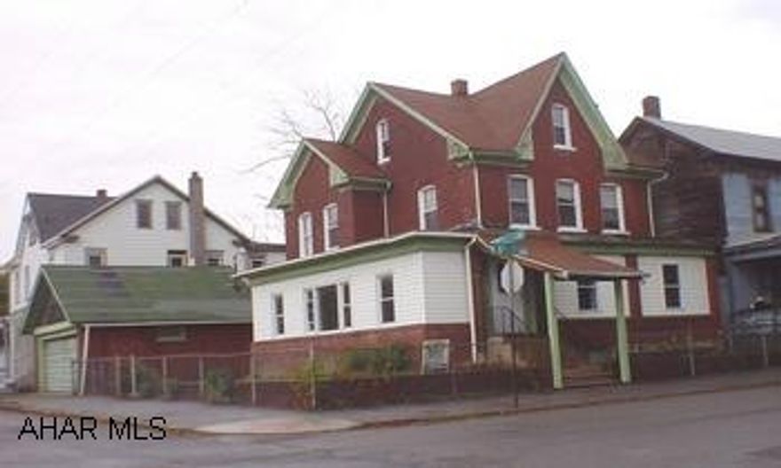 Extra large home was former physician's office & residence, fromt & side proch closed in, which served as a waiting room area, hardwood floors, and court yard. Extra large home was former physician's office & residence, front & side porch closed in, which served as a waiting room area, hardwood floors and court yard.