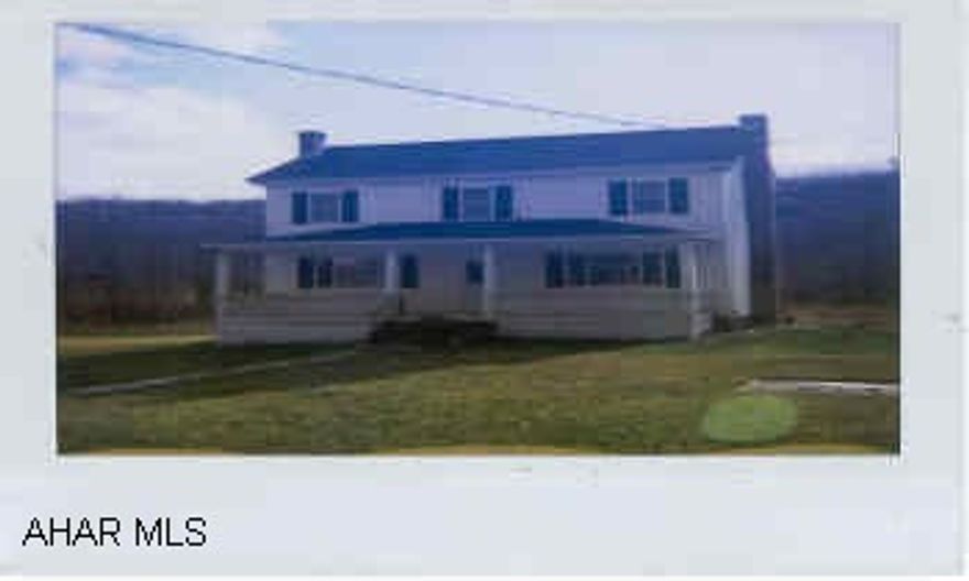 Exterior has newer roof, siding & windows.  Interior needs some finishing.  To be sold "As Is."  Additional lot suitable for building or Mobile Home.