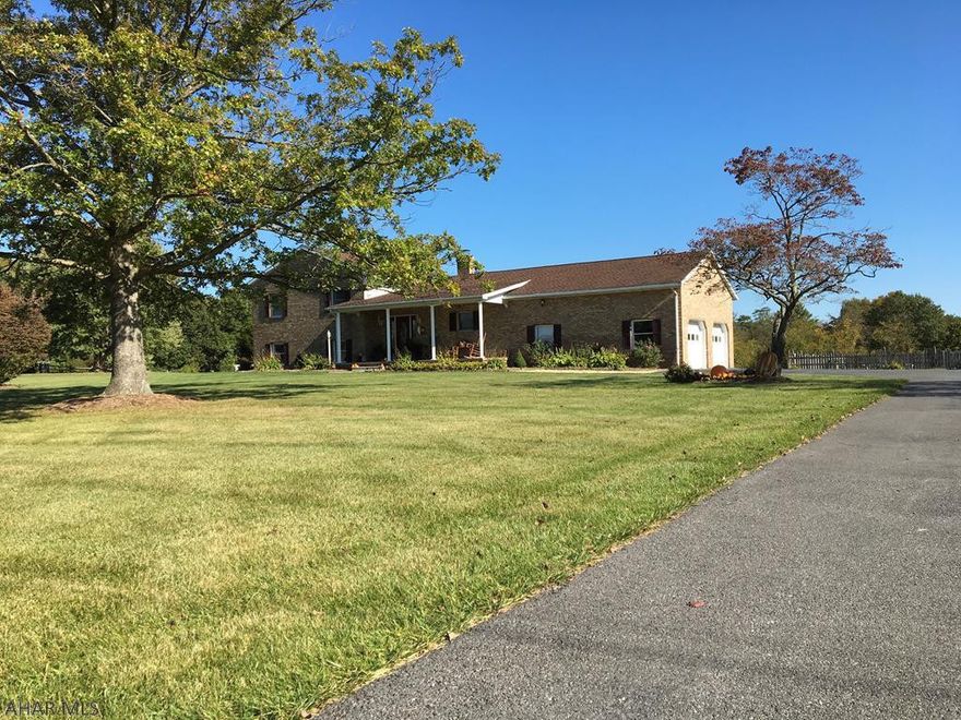 Location, Location, Location this Multi Level Brick Home has it all! One mile from Rt 70 comes out at the Amaranth Exit close to Md line and Rt 30 and Pa turnpike going the other direction. Beautiful yard and landscaping , bountiful garden, strawberry patch and white and blue grape arbors. Front porch with mountain views and rear patio looks out to 36X18 inground pool, surrounded by wood fence. Family room, Office, Bath, Laundry room on lower level. Foyer, Kitchen, Dining Area, Living Room and Two Car Garage on main level. Three Bedrooms and Two Baths on upper level. Heat pump and central air, plus a wood stove for added warmth. Kitchen appliances and window treatments included. Take a look at this superb home on 2.66 acres it is everything you could want and more!