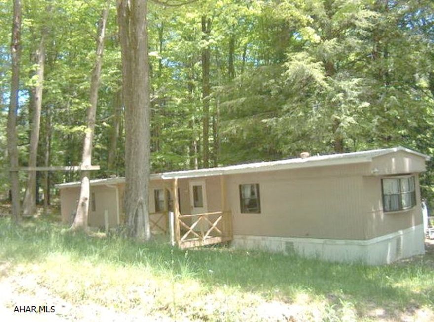 Well kept single wide mobile home with new metal roof inside Glendale Yearound. A Must See! Great hunting camp or get-away