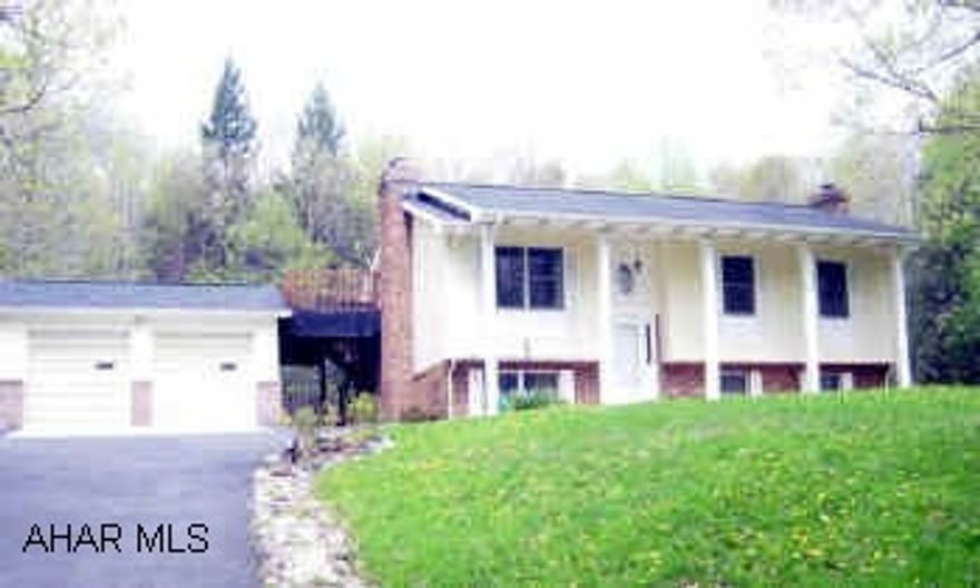 Sinking Valley - Private setting 3.5 acres - stream fed irrigation system, fruit trees, shed, covered deck, master suite w/bath & deck, 2 car garage & carport. Large family room w/stone fireplace.