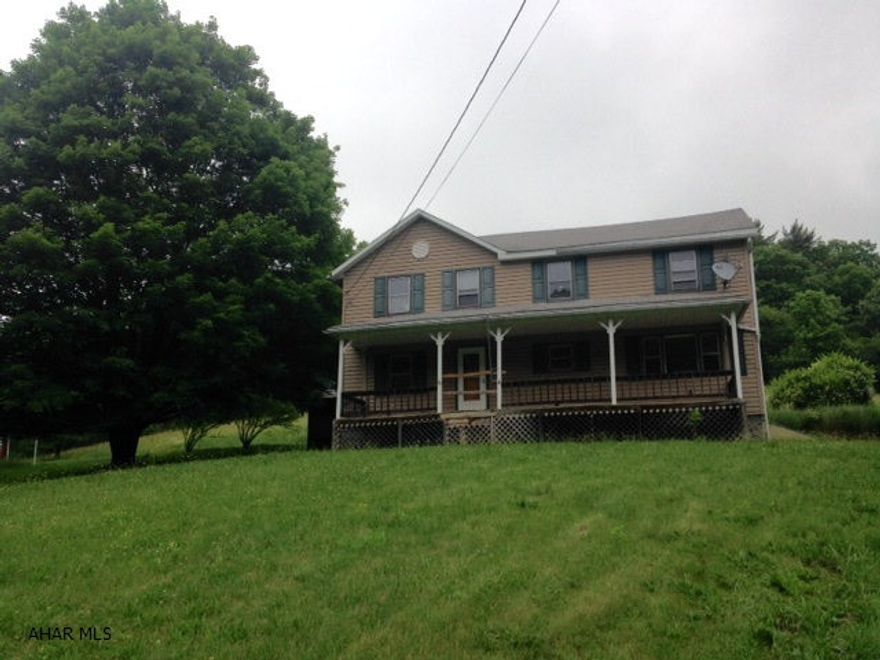 Two story in beautiful rural setting on 4.45 ac. House needs lots of TLC.