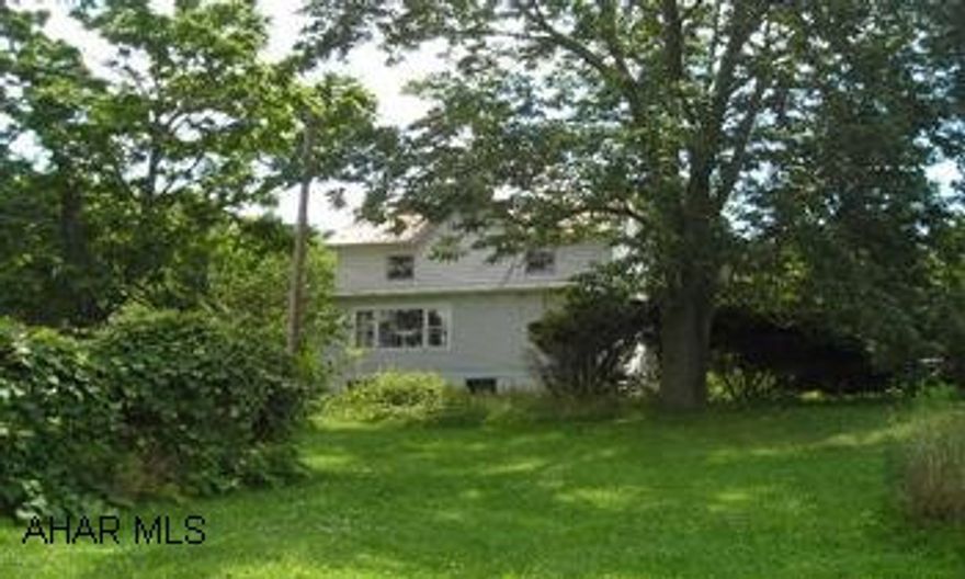 Fixer upper on 3+ acres; 2 septics, furnace 10 yrs old, well pump 3 yrs old, chimney flue 3 yrs old, electric panel 6 yrs old- 100 amp service. Nice views, peaceful setting. Woven wire fence marks boundaries. Sq. ft. estimated.