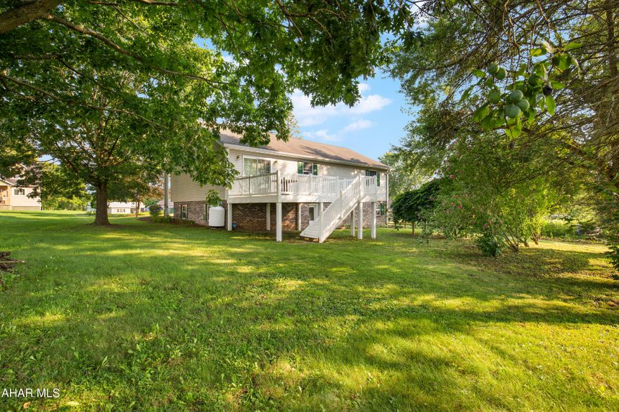 Solid, well maintained home in East Taylor Twp.  centrally located between Johnstown & Ebensburg!   This 3 bedroom, 3 bath split entry home has a large 2 car garage, shaded backyard & newer deck with sliding glass door with entry to the dining room/kitchen.   Brick and vinyl siding construction: beautiful landscaping and great curb appeal!  Hardwood floor entry then upstairs to the living room, dining room, kitchen, bedrooms & 2 full baths or downstairs to the family room, laundry room, half bath & garage.  The master bathroom has a newer step in shower for extra convenience.  It's obvious that this house has been loved and cared for.