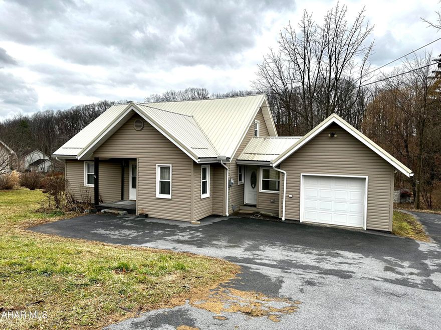 Situated on a beautiful 1 acre lot just outside of Altoona, this move-in ready home has it all! This property features 3 bedrooms with 2 full bathrooms, with a sizable eat in kitchen. There is new flooring throughout along with a newer metal roof. Just off the mud room, is an attached one car garage. A large deck overlooks the scenic backyard! Call for your showing!