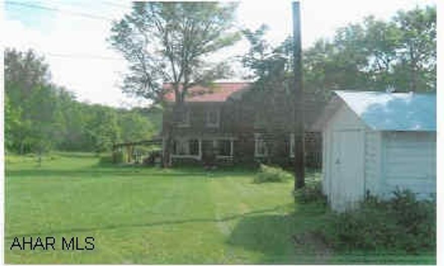 9.39 +/- Acre site with older brick farmhouse. Frankstown Township.