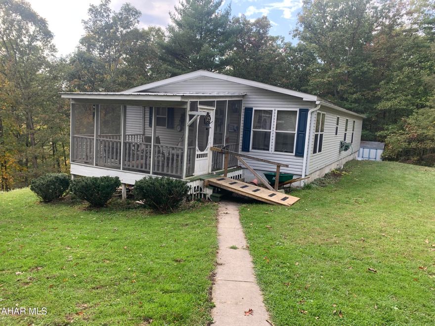 Welcome to the country. Sit on your screened in porch and listen to the birds chirp. Hang out in the walk out basement /family room or get to work in the garage work shop. This property offers 3 bedrooms and two baths, a cozy sitting/TV room, and a spacious living room.  It  also offers an eat in kitchen, a dining room and a laundry room. The large basement has a family/game room which could accommodate a nice size crowd for entertaining. There is a one car garage which has a small workbench area for your projects.  Outside storage shed to store the lawn mower and garden tools. The property is located near the HB and T trail and close proximity to state game lands.