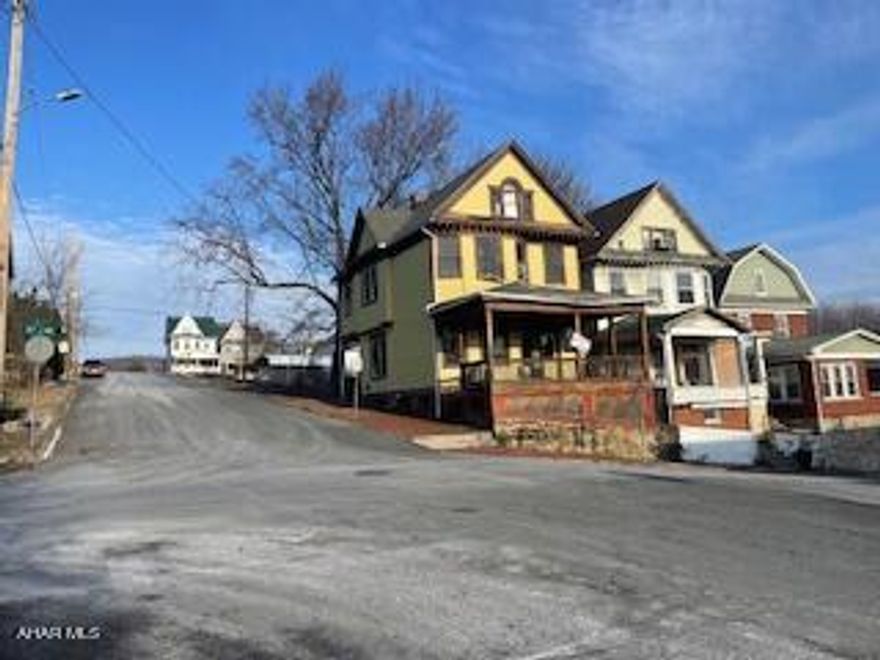 Large home on a corner lot. Needs a lot of work.  Great project for a contractor . 2nd floor has 3-4 Bdrs and 3rd floor could have 2 more.  Pretty much gutted and ready to be redone.  Will need plumbing work. Poperty is SOLD ''AS IS''.  Seller will not make any repairs.