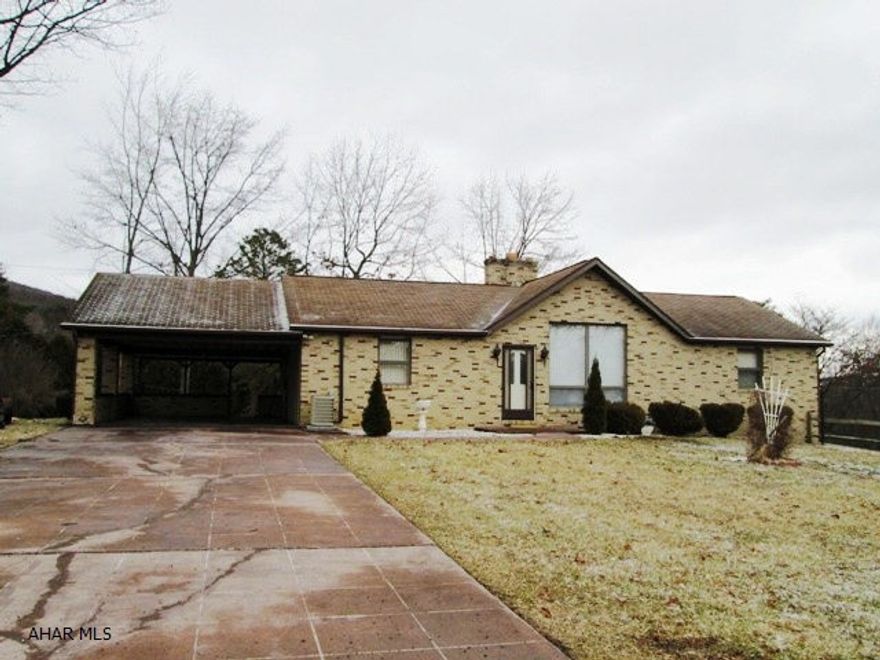 Custom built ranch home featuring vaulted ceilings!  Spacious living room with stone fireplace.Formal dining room opens to a heated 3 season sunroom.  Eat in kitchen with all appliances.  Lower level is finished with office and family room with 3/4 bath.  Don't miss the 3 car garage and the carport! This quiet location also offers a house with loads of storage.