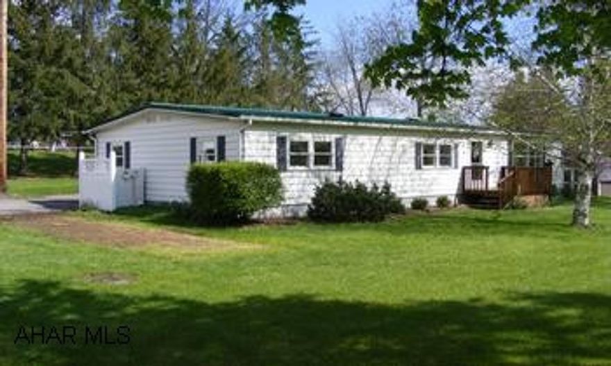 Absolutely immaculate & beautifully maintained Doublewide home. New metal roof 2005. Almost all new Anderson windows, new plumbing, new kitchen cabinets and countertops.New living room carpeting.Cute den w/woodburner, great screened porch.-these are just a few of the many updates. Call Dianne 329-1856 for details. PLEASE REMOVE SHOES FOR SHOWINGS.