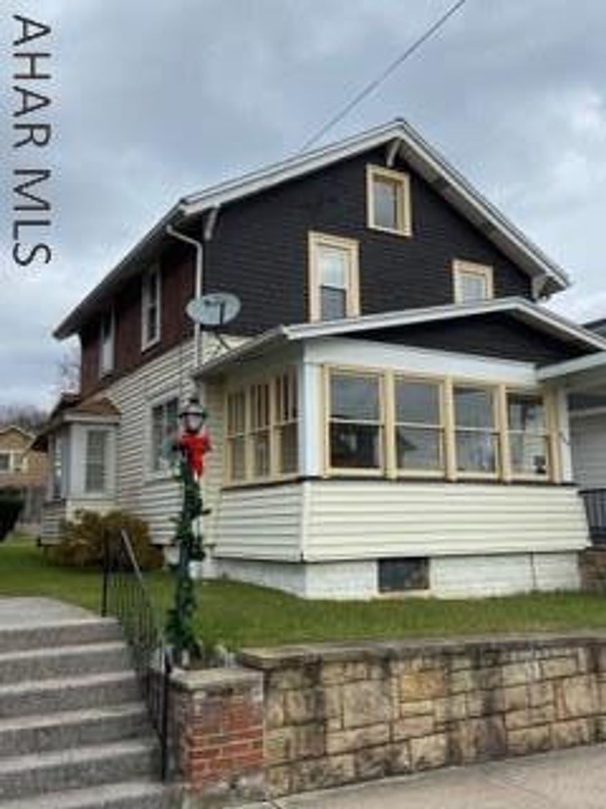 Location, Location Location!!!  Make this beautiful 3 bedroom 1 bath your home. Enjoy the covered front porch during summer evenings. Enjoy the spacious covered back deck with family and friends. The large yard is an amazing bonus for anybody to use!!! Did we mention, the 3 bay garage that you can park your vehicle and have space to tinker around. Off street parking. Beautiful hard wood floors through out the house. Kitchen has many upgrades. Nice size master bedroom with two closets. Updated bathroom. Newer furnace, Newer hot water tank. Beautiful house, great location, priced right. You will call this place your home! :)