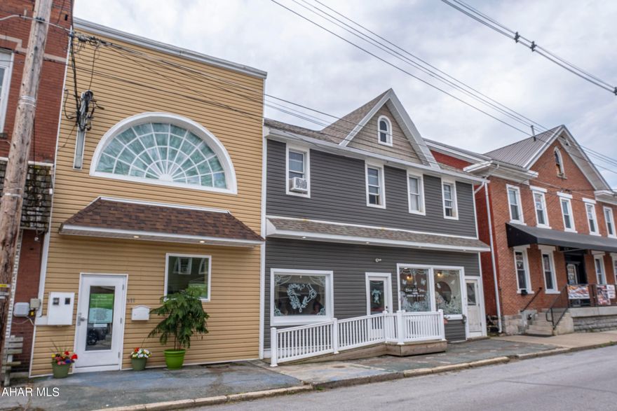 Don't miss this opportunity to own a prime multi-unit investment property! This building includes two distinct units: Unit 1 is a business office (approx. 2000 sq. ft.) complete with a conference room and waiting area, while Unit 2 is a full-service hair salon (approx. 1104 sq. ft.). The second floor features a spacious apartment unit (approx. 2000 sq. ft.) that is currently leased. Additionally, there is an open unit (approx. 1587 sq. ft.), perfect for converting into apartments or additional commercial space. Each unit has its own entrance, and the building is handicap accessible with both a private parking lot and off-street parking.