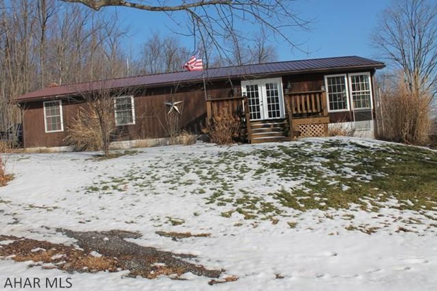 Welcome home to this well maintained mobile home situated on 2 acres of wooded land. This home features all the conveniences of single floor living. Plenty of space and amenities for enjoying the outdoors year round. This home has a patio and deck as well as an above ground pool for those hot days. Home is placed on a foundation and has a full unfinished basement. Schedule your appointment today.