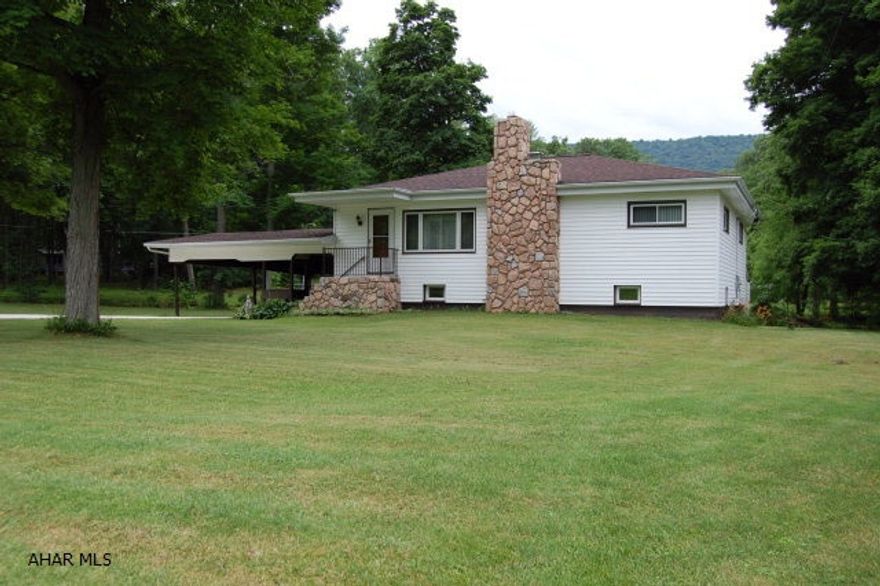 REDUCED!!!!  Looking for a Ranch Style 3 bedroom home situated on over an acre flat lot?  Private setting just minutes from downtown Hollidaysburg.  Here's your chance.  Large family room with hardwood floors.  Large eat-in kitchen with plenty of cupboards for storage.  Newly updated full bath on main level of house.  Partially finished basement with new furnace and central air.  New concrete driveway and top of the line Pella windows.