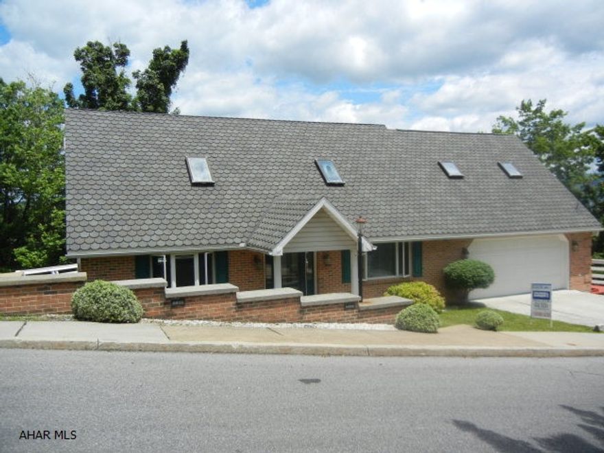 Walking distance to PSU Campus. Lovely open floor plan w/cathedral ceiling & skylights over living area. Combination of Hw & carpeting. Second floor overlooks living space. All bathrooms are large. Private rear deck with great view. Walk-out basement is finished and offers area for mother-in-law suite. Limited exterior maintenance required. Wrap around deck great for summer entertaining.