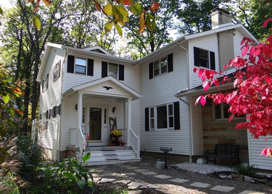 Private and Peaceful wooded setting at the end of the Lane. Large 5 BR, 3 Bath home with a 2 car garage. Features Two Master Suites (one on each floor); Hardwood floors throughout; Large Deck for outdoor living; Family room with Fireplace; Lots of Closets; Shed; and Large 1st floor Laundry with sink, countertop, and cabinets. Beautiful property in a scenic and convenient location. Out of town, but not far from everything.