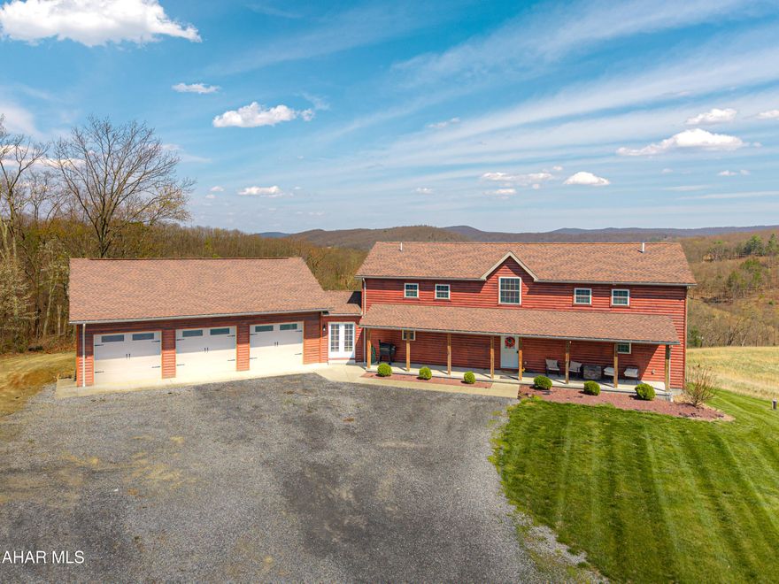 Escape to your own private mountain retreat with this absolutely beautifully maintained and well built log-sided home resting on 29.88 acres. A generous entry foyer welcomes you into a stunning great room featuring a cathedral ceiling and a striking stacked stone fireplace--ideal for relaxing or entertaining. The spacious kitchen is equipped with stainless steel appliances, island/breakfast bar, and flows seamlessly into the dining area. The primary suite offers a peaceful retreat with a walk-in closet and a well-appointed bath featuring a soaking tub with stone surround, double bowl vanity, and separate ceramic tile shower. There is a mud room and a convenient main level laundry room with a half bath. One the second level you will find a cozy loft area perfect for an office, reading area, or just enjoying the views above the great room. Three additional bedrooms and a full bath provide ample space for family or guests. The newly partially finished basement includes a ground-level walkout and is already rough-plumbed for an additional bathroom, offering excellent potential for expanded living space. Comfort is ensured year-round with a heat pump and central air, plus electric hot water radiant floor heat on both the main level and basement. Warm and inviting blends of hickory hardwood and ceramic tile floors, solid six panel doors, recessed lighting throughout, all complemented by knotty pine walls/ceilings, and drywall for a perfect balance of rustic charm and modern appeal. Step outside to enjoy the large covered front porch or rear deck, perfect for taking in the breathtaking mountain and sky views and in this serene, private setting. ATV, hike, hunt, or just enjoy wildlife on your OWN land. Spacious three-car attached garage with 12' x 40' loft and a 20' x 24' outbuilding allowing for all your storage needs for vehicles, boats, or toys. Property is located close to State Game lands, the H&BT rails to trails, the Juniata River, and less than one hour from Lake Raystown. This well-cared-for property offers the ideal combination of space, comfort, and natural beauty--don't miss your opportunity to own this exceptional home or retreat in beautiful Bedford County, PA.