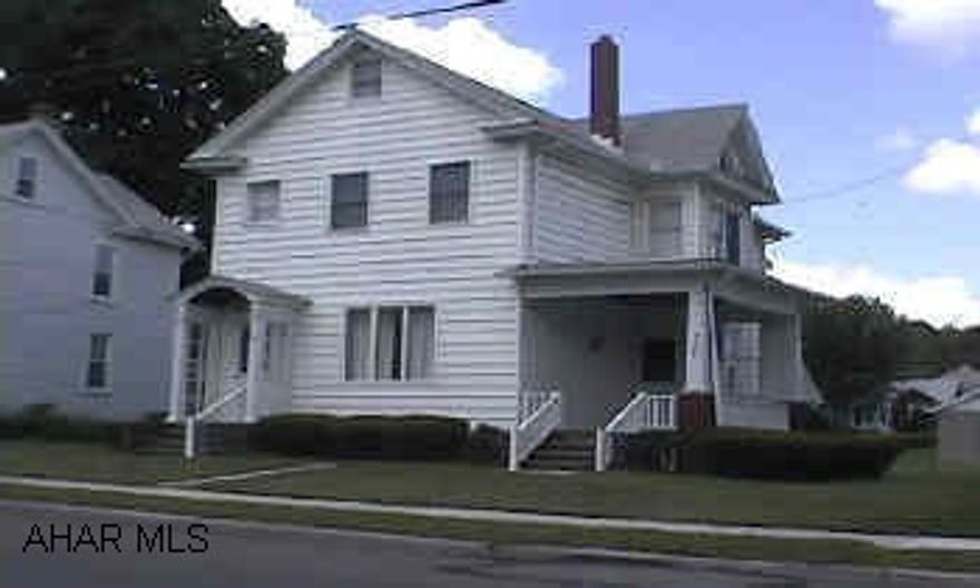Very good 2 1/2 story home.  Presently used as a duplex.  Kitchen, Living room, Dining room, 2 bedrooms on each floor. Home in very good condition.  Separate electric.  Tenant has 6 months lease,  pays $350.  Heat and water and sewer encluded.  Separate 2 car garage.  All first floor appliances stay.