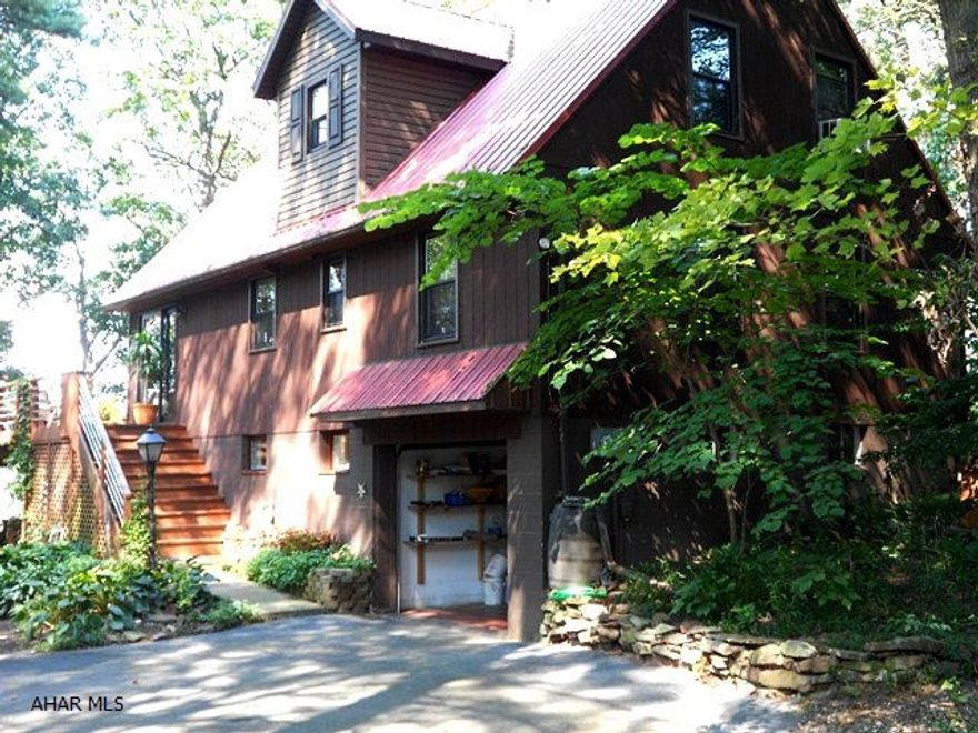 Private retreat sits on a bluff over the Raystown Branch of the Juniata River w/ 90 ft of river frontage at bottom. A-frame home w/ natural surroundings. 3 BR, 3 BA, 3 level stone fireplaces. Fantastic rear deck, newer metal roof. Lots of furniture included. Truly a nature lovers dream!