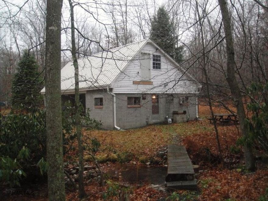 A Hunter's Paradise! Private & serene with Buchanan State Forest bordering the property offering excellent hunting. Beautiful setting with cabin peacefully nestled into the woods. Picturesque foliage & year round stream on the property. 2 story, first floor with 2 BRs, 1 full bath, kitchen , dining area & LR w/ stone fireplace. Second floor with 2 BRs in a loft style atmosphere. Hunting, hiking, and area snowmobile trails are just a few of the activities available. Property is 10 mi from Rocky Gap State Park offering swimming, boating, fishing and Rocky Gap Casino & Resort and Jack Nicklaus Signature Golf Course. Property is 10 mi to Rt 68 and 17 mi from Cumberland, MD. If you are looking for an exceptional seasonal get away or hunting camp, this one is for you!