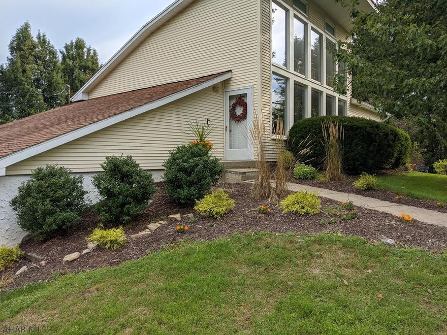 Unique, contemporary eco home in Stormstown subdivision! Minutes from State College, in SCASD! Corner lot w/passive solar design provides winter warmth & plenty of natural light. The open floor plan includes modern kit w/granite counters, maple cabinets, stainless appliances and bamboo fl. Beam loft above the LR is bright, must see area! Walk-out basement includes 4th BR, 1/2BA/laundry, storage room & home office/fam room w/wood stove. Enter lower level from the attached garage or stamped concrete patio, covered by large upper deck. Fantastic for relaxing or entertaining on 1.10 AC landscaped prop w/healthy, mature shade trees; fenced vegetable garden and ample open space. 10 minute walk to newly refurbished Autumn Meadow Park and State Game Lands #176.