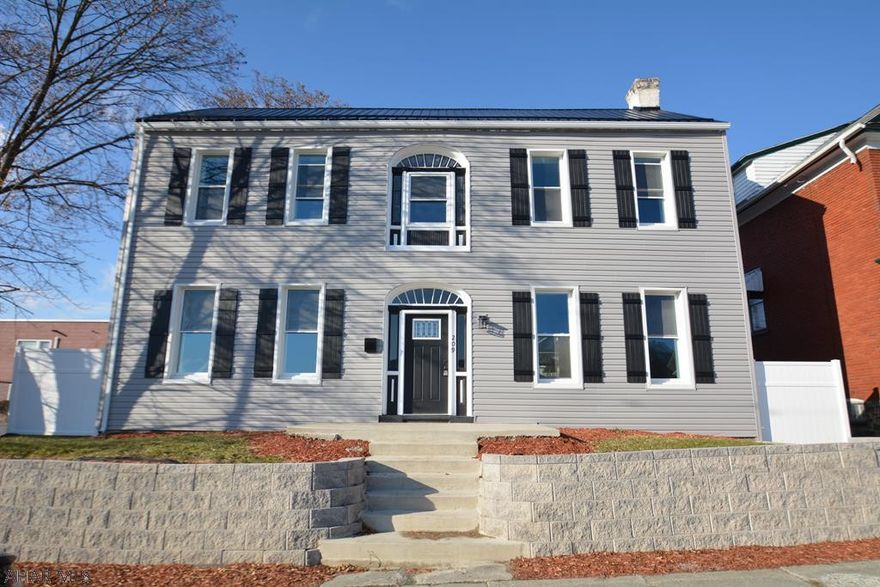 This historic house has lots to offer!  It has been given a new look with new flooring, new kitchen, new paint, new deck, new parking area, new roof, new siding, new NGFA furnace, new plumbing, new wiring.  It is ALL done for you!  Just move in!  The foyer has new tile and the rest of the house has new carpeting.The kitchen is all new tile, cabinets and appliances. It is a HUGE area that includes the dining room!  The living room boasts a fireplace area and a new mini split! At the top of the stairs is a great sun room area where you can sit and take a look at the mountains.  The bedrooms are large with lots of light and new mini splits.  The back offers a great deck for entertaining and 3 off street parking spots.  Lots of yard area too! All this priced under appraised value!